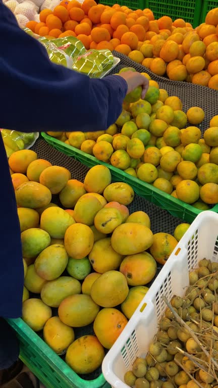 Colorful Market Arrangement of Mangoes and oranges
