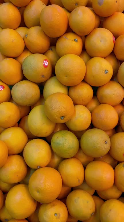 Colorful Market Arrangement of Mangoes and oranges.