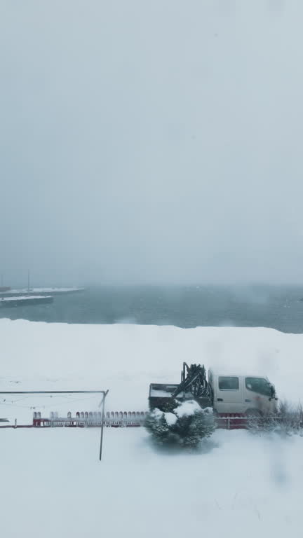 Timelapse Backyard with coastline during winter snowing