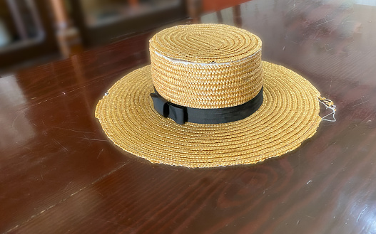 A straw hat sits on a counter