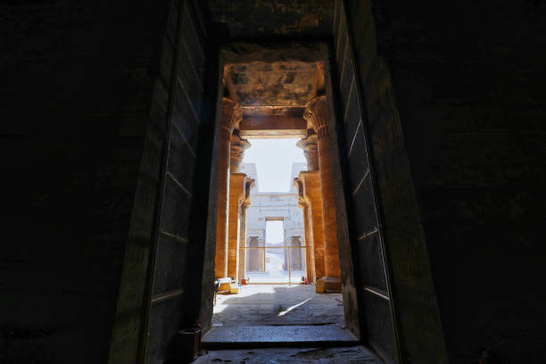 Entrance to the temple flanked by soaring floral columns in the Temple of Horus at Edfu built during the Ptolemaic era between 237 to 57 BC near Aswan,Egypt