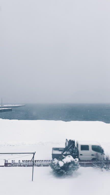 Timelapse Backyard with coastline during winter snowing