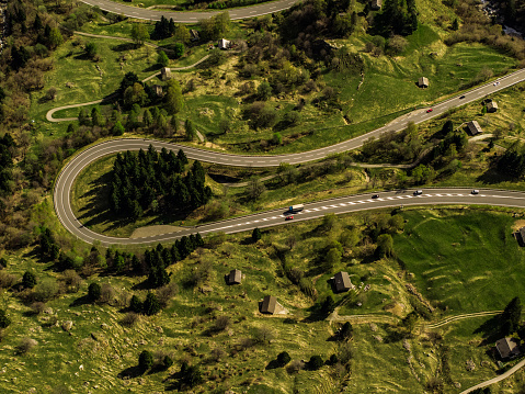 Directly from above view of a winding mountain road, San Bernardino Pass in Swiss Alps.