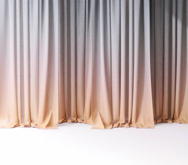 istock Modern orange and purple gradient drapery curtain on stage floor in sunlight from window 2150077733