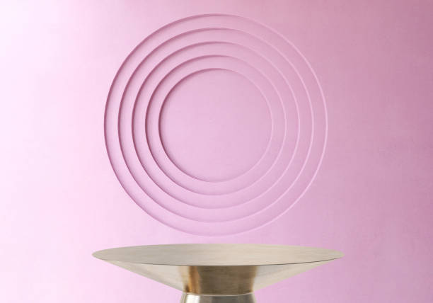 istock Gold shiny round steel pedestal podium table with purple modern abstract debossed circle background 2150077776