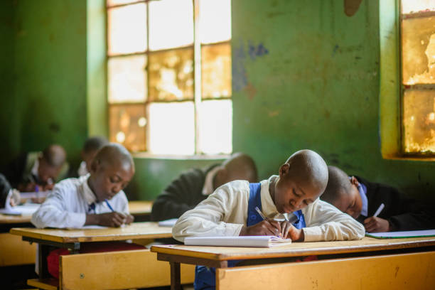 African children writing exams in rural school classroom, Malealea Lesotho
