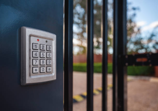 Access control keypad on a gate at an agricultural facility