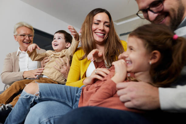 istock Playful extended family having fun at home. 2150078974