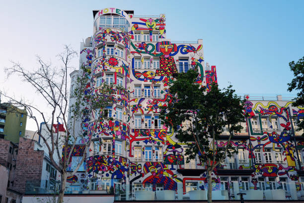 Palma, Mallorca Island, Spain - April13, 2024: Colorful decorated facade of modern architecture hotel building in downtown Palma from below against clear sky. Urban Street View in Palma Downtown, Majorca Island, Balearic Islands, Catalonia, Spain, Europe