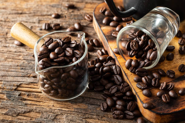 istock coffee beans with glass on wooden background 2150079210