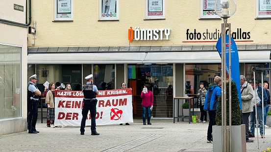 Ludwigsburg, Germany - April, 15th - 2024: Demonstration in the Seestraße. People standing and shouting against a political party.