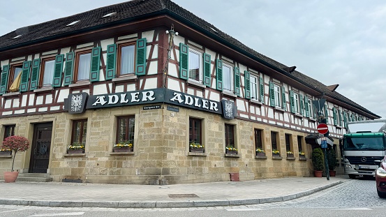 Asperg, Germany - April, 9th - 2024: Restaurant Adler building, founded in  1897, facade at the Main Street.