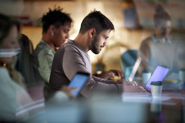 istock Young creative man working on laptop in the office. 2150080100