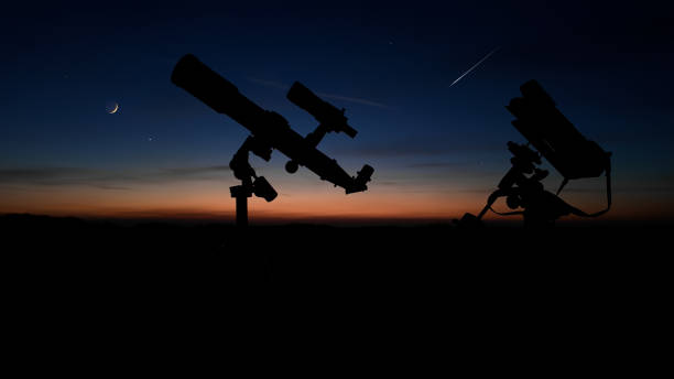 istock Astronomical telescope and camera on a startracker tripod for observing and capturing stars, planets, Moon and other cosmic celestial objects. 2150080241