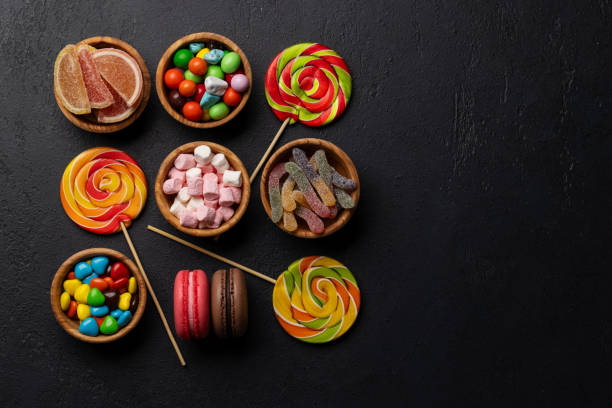istock Various colorful candies, lollipops, and macaroons 2150080677