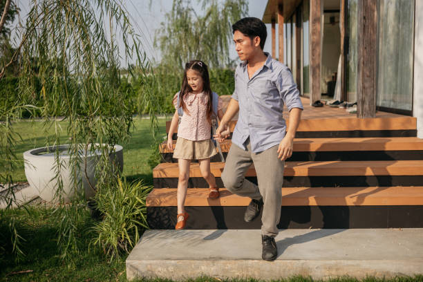 istock Father and daughter heading to school 2150080812