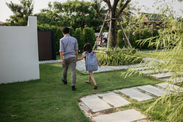 istock Father and daughter heading to school 2150080830