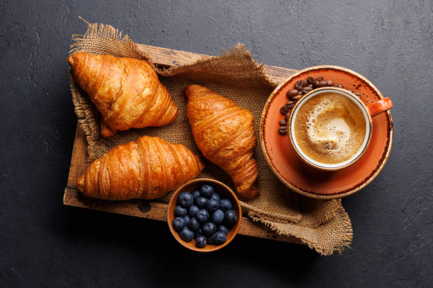 istock Cappuccino coffee and fresh croissants 2150081962