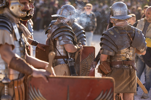Rome, Italy, April 21, 2024: Parade for the birth of Rome on April 21, 2024 in Rome, Italy. People dressed in costume as gladiators, centurions, senators, handmaids and ancient romans citizens participate to a reenactment of the ancient Roman Empire, to celebrate the birth of the Eternal City.