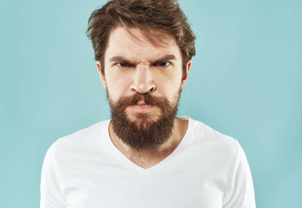 istock aggression stress man with a beard emotions indignant look fist 2150082073