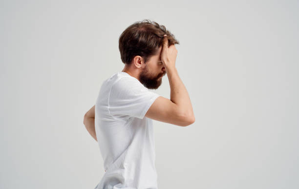 istock a man with a beard gesturing with his hands back pain spine load heaviness 2150082299