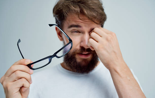istock bearded man in white t-shirt with glasses vision problems 2150082323
