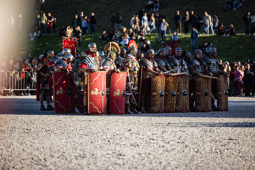 Rome, Italy, April 21, 2024: Parade for the birth of Rome on April 21, 2024 in Rome, Italy. People dressed in costume as gladiators, centurions, senators, participate to a reenactment of the battle against Spartacus of ancient Roman Empire, to celebrate the birth of the Eternal City.