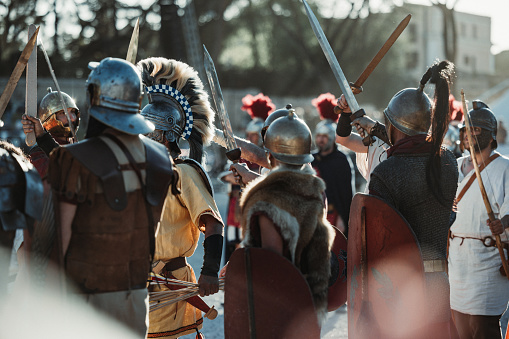 Rome, Italy, April 21, 2024: Parade for the birth of Rome on April 21, 2024 in Rome, Italy. People dressed in costume as gladiators, centurions, senators, handmaids and ancient romans citizens participate to a reenactment of the ancient Roman Empire, to celebrate the birth of the Eternal City.