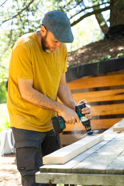 istock Middle-aged Caucasian man working sanding wood with an electric sander 2150083350