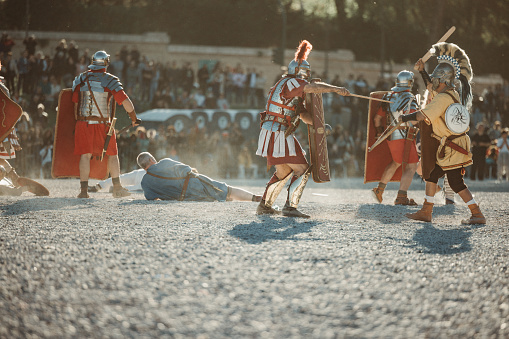 Rome, Italy, April 21, 2024: Parade for the birth of Rome on April 21, 2024 in Rome, Italy. People dressed in costume as gladiators, centurions, senators, participate to a reenactment of the battle against Spartacus of ancient Roman Empire, to celebrate the birth of the Eternal City.