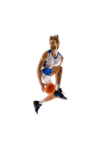 istock Slam dunk. Young, focused man, basketball player in motion, leaps a dunk, training isolated on white background 2150084168