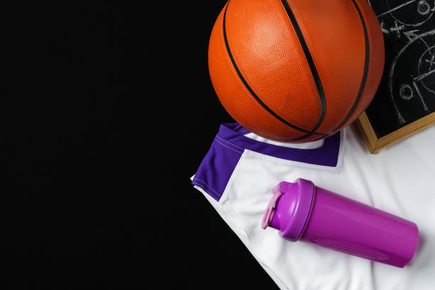istock Basketball Strategy Planning With Chalkboard, Ball, and Jersey on Dark Background 2150084351