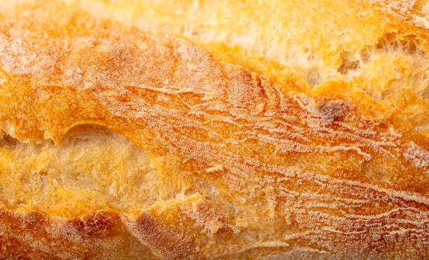 istock Ruddy crust of bread as an abstract background. Texture 2150085151