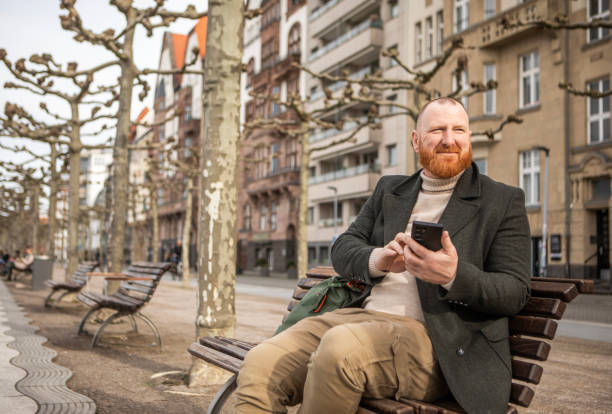 istock Redhead tourist man interacting with a smartphone 2150086038