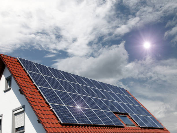 istock Solar panels on house roof renewable energy net zero emissions 2150086373