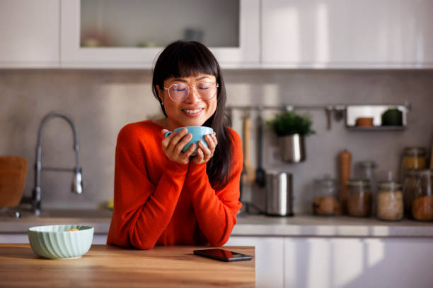 istock Woman drinking morning coffee in the kitchen 2150087166