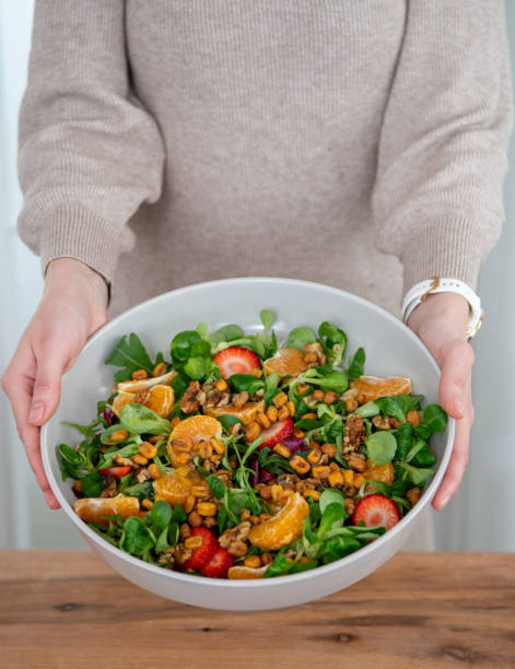 istock Person holding salad bowl 2150088477