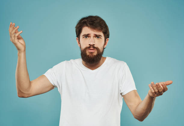 istock Emotional guy gesturing with his hands on a blue background Copy Space Model cropped view 2150091352