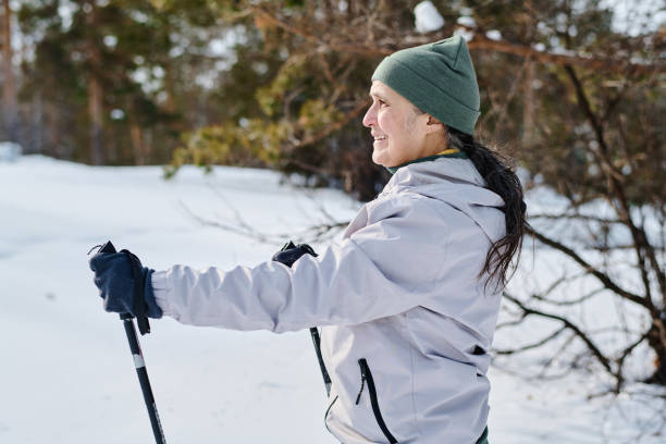 istock Senior Woman Skiing In Park 2150093824