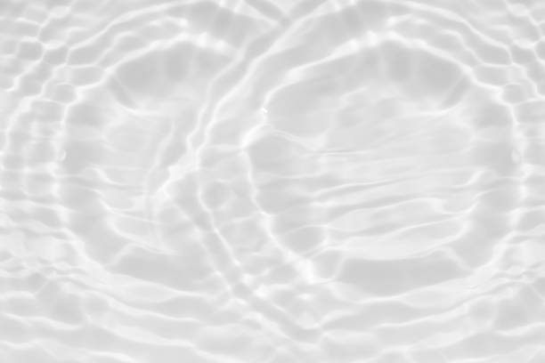 istock Bluewater waves on the surface ripples blurred. Defocus blurred transparent blue colored clear calm water surface texture with splash and bubbles. Water waves with shining pattern texture background. 2150094297