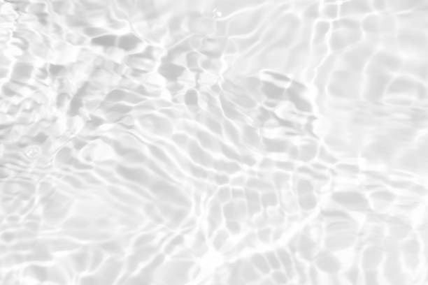 istock Bluewater waves on the surface ripples blurred. Defocus blurred transparent blue colored clear calm water surface texture with splash and bubbles. Water waves with shining pattern texture background. 2150094307
