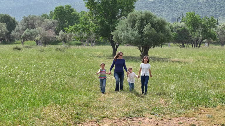 Family walking outdoors in summer