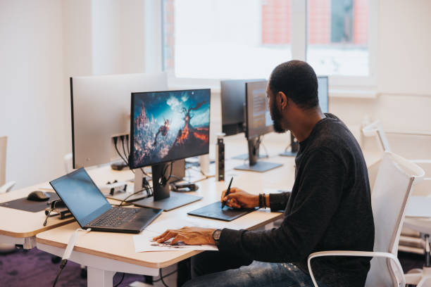 African male gaming designer, working on a new video game