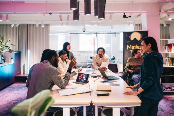 istock Group of diverse gaming designers, working with character sheets on their new virtual game 2150096514