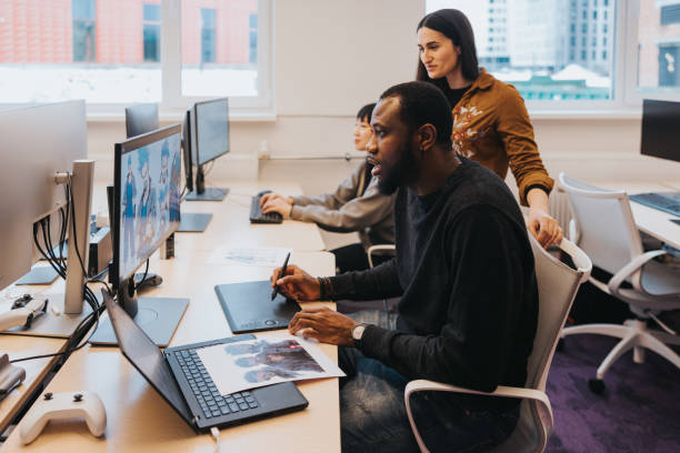 istock Two gaming designers, working on a new video game 2150096517