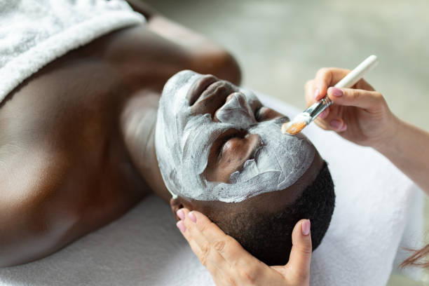 istock Beautician applying face mask 2150097185