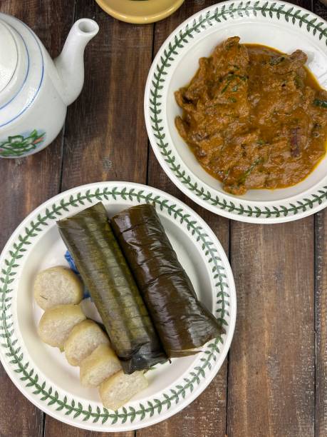 istock Glutinous rice is wrapped with banana leaf encased in bamboo culm and cooked in open fire. Lemang is a must have in every local Malay household, eaten with beef or chicken rendang 2150097199