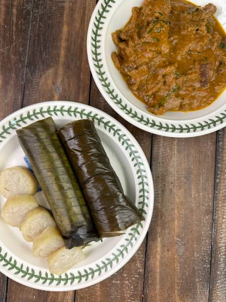 istock Glutinous rice is wrapped with banana leaf encased in bamboo culm and cooked in open fire. Lemang is a must have in every local Malay household, eaten with beef or chicken rendang 2150097201