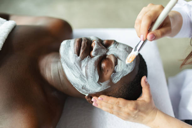 istock Beautician applying face mask 2150097273