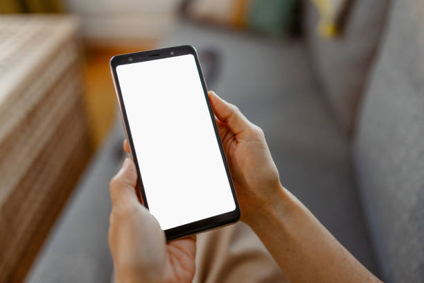 istock Mockup Image of Blank White Screen Cell Phone in Woman Hands 2150098423